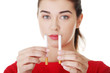 Woman holding classic cigarette and  electronic cigarette