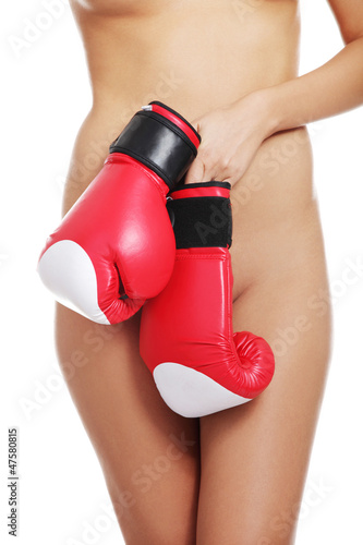 Photo: Nude woman body with boxing gloves. Nude woman body with boxing gloves.