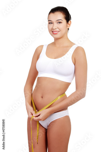Photo: Pretty smiling woman with measurement type Pretty smiling woman with measurement type