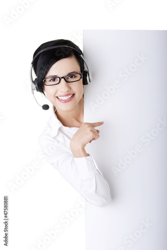 Photo: Call center worker holding blank sign board Call center worker holding blank sign board