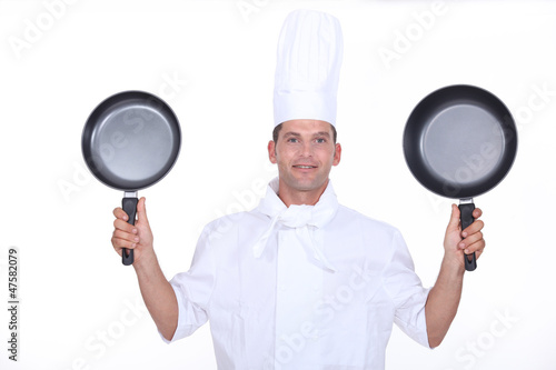 Photo: Chef with two pans Chef with two pans
