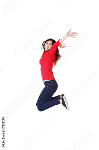 Photo: Happy caucasian woman jumping in the air Happy caucasian woman jumping in the air