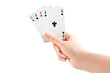 Four of a kind, woman hand holding four aces on white background