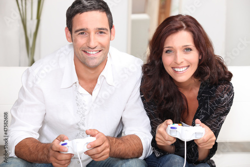 Photo: Couple playing computer games Couple playing computer games