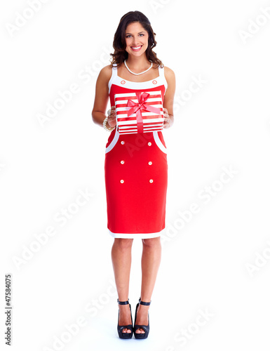 Photo: Beautiful young girl with a Christmas present. Beautiful young girl with a Christmas present.
