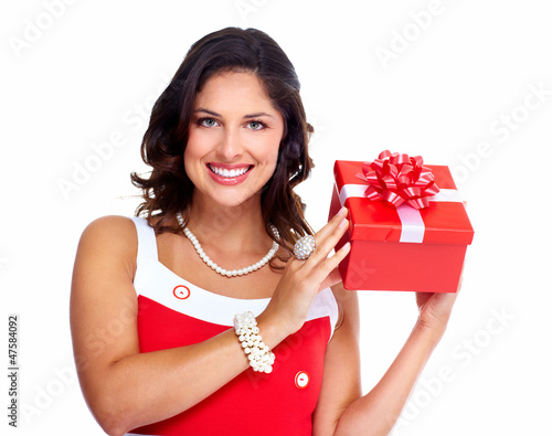 Photo: Beautiful young girl with a Christmas present. Beautiful young girl with a Christmas present.