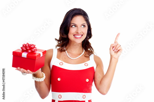Photo: Beautiful young girl with a Christmas present. Beautiful young girl with a Christmas present.
