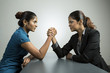 Business women fighting for control.