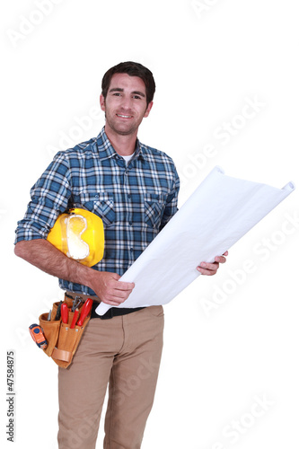 Photo: Carpenter with plans Carpenter with plans