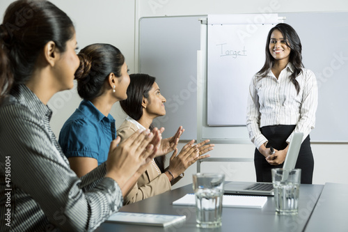 Photo: Indian business woman doing a presentation. Indian business woman doing a presentation.