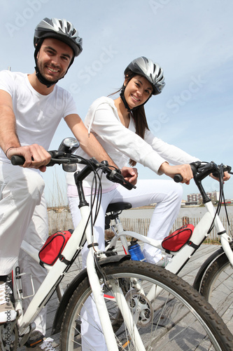 Photo: Couple out for a bike ride Couple out for a bike ride