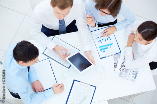 Photo: Discussing documents Discussing documents