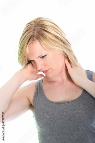 Photo: Young woman with neck ache Young woman with neck ache