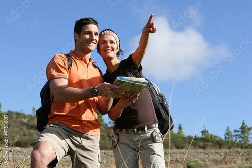 Photo: Explorers reading a map Explorers reading a map
