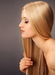 Blond Hair.Beautiful Woman with Straight Long Hair