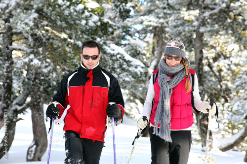 Photo: Couple show-shoeing Couple show-shoeing