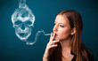 Young woman smoking dangerous cigarette with toxic skull smoke