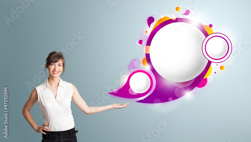Photo: Attractive woman presenting abstract speech bubble copy space Attractive woman presenting abstract speech bubble copy space