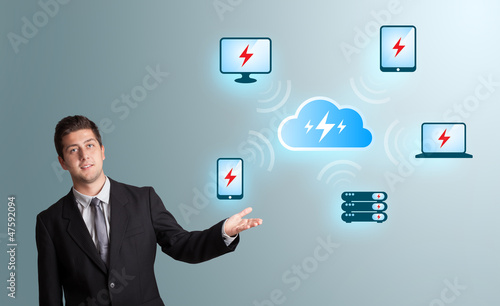 Photo: Young man presenting cloud computing network Young man presenting cloud computing network