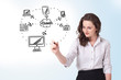 Young woman drawing a cloud computing on whiteboard