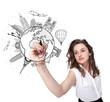 Young woman drawing a globe on whiteboard