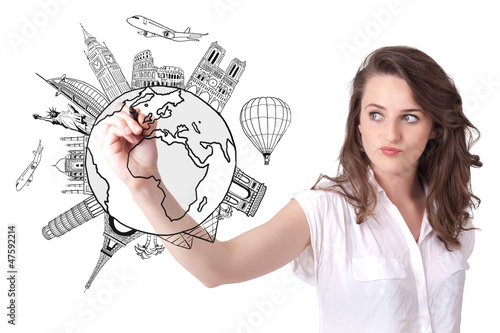 Photo: Young woman drawing a globe on whiteboard Young woman drawing a globe on whiteboard