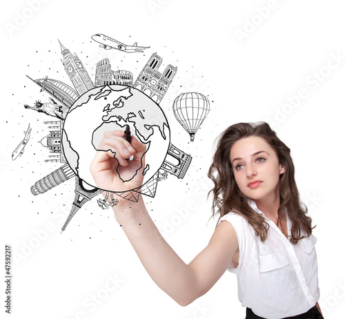 Photo: Young woman drawing a globe on whiteboard Young woman drawing a globe on whiteboard
