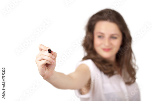 Photo: Young woman drawing on wihteboard Young woman drawing on wihteboard