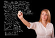 Woman drawing business scheme and icons on whiteboard