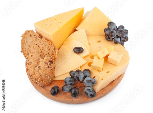 Photo: Cheeses on wooden Cheeses on wooden
