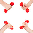 Red dumbbells in the hands of a man, isolated