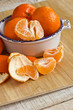 Fresh ripe mandarines on wooden background