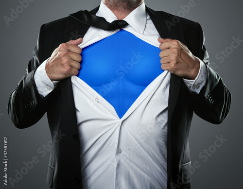 Photo: Young businessman acting like a super hero Young businessman acting like a super hero