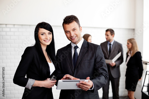 Photo: business people working with digital tablet business people working with digital tablet