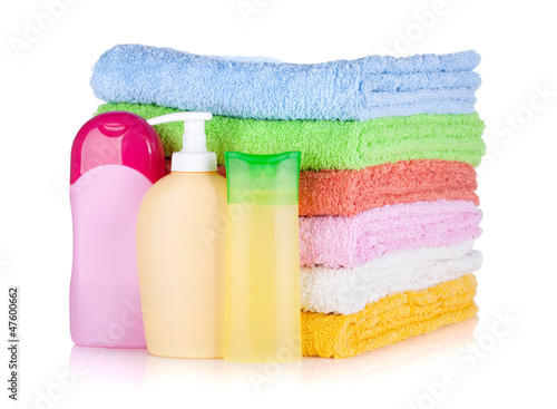Photo: Cosmetics bottles and towels Cosmetics bottles and towels