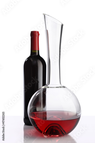 Photo: glass and bottle of red wine decanter glass and bottle of red wine decanter