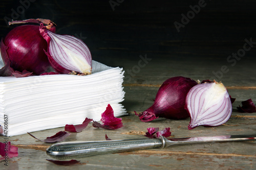 Photo: Red onions on a pile of paper tissues Red onions on a pile of paper tissues