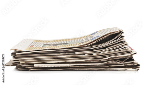 Photo: newspapers isolated on a white background newspapers isolated on a white background