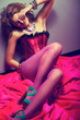 Sensual Girl in Red Corset and Stockings in Elegant pose