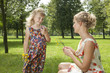 girl gives a flowers mother
