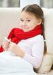 Ill little girl is reading thermometer