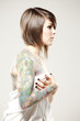 Photo: Girl with tattoos in sheet Girl with tattoos in sheet