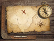 aged brass antique nautical compass on table with old treasure m