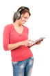 Photo: Young student girl with tablet pc and headphones Young student girl with tablet pc and headphones