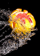 Carved grapefruit in a stream of water