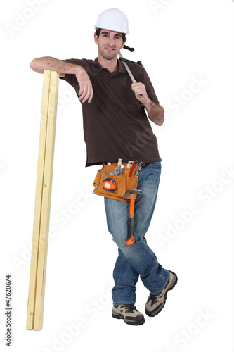 Photo: Carpenter with timber Carpenter with timber