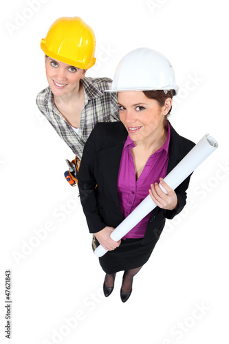 Photo: businesswoman and craftswoman posing together businesswoman and craftswoman posing together