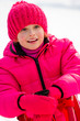 Little girl have fun on sled
