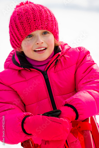 Photo: Little girl have fun on sled Little girl have fun on sled