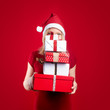 pretty young girl holding a christmas gift having fun